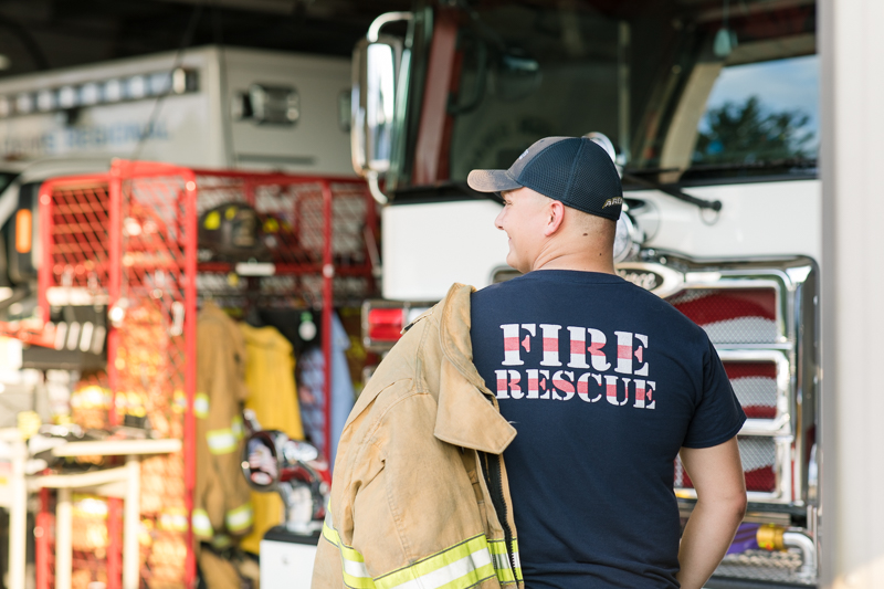 This Fairfield firefighter senior session was perfect for Tyler. After time at the station, we headed to the farm for a rustic outdoor senior session. For more Fairfield senior photo ideas visit www.jamiefishercollective.com | Jamie Fisher Collective